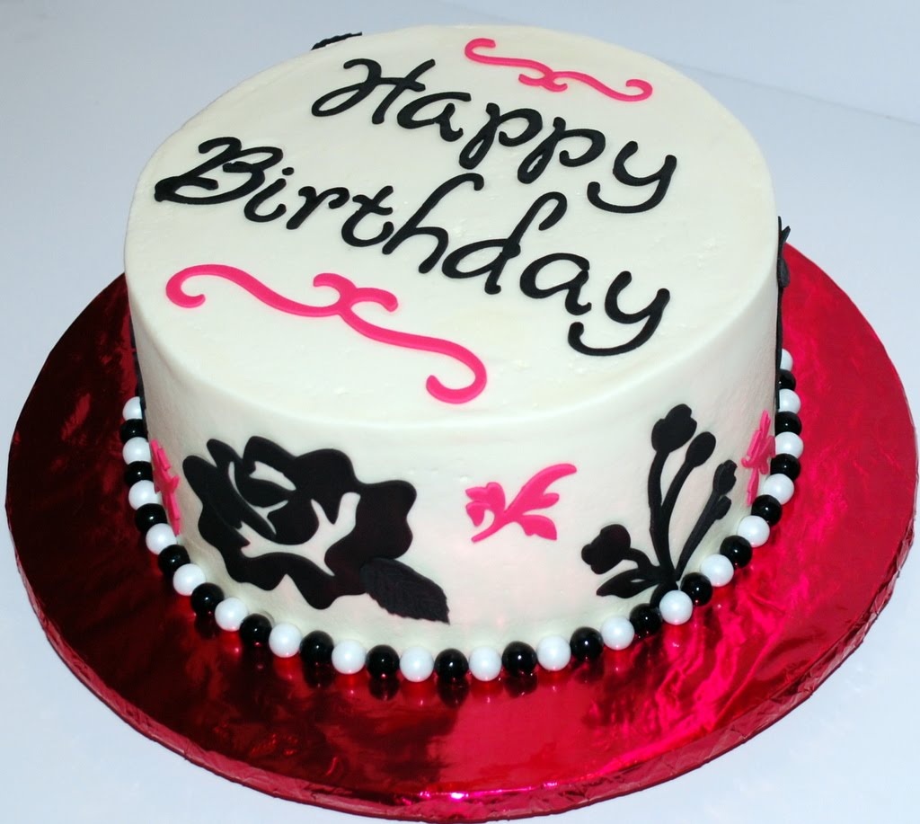 birthday cake with white icing  and pink letters